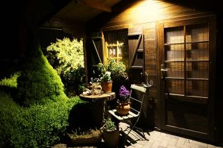 Shed at night with table and chairs outside