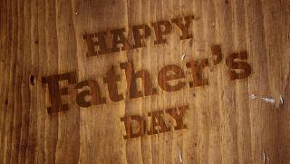 Happy Father's Day message on wooden board