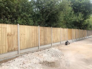 Tanalised closeboard panels with concrete posts and gravel boards