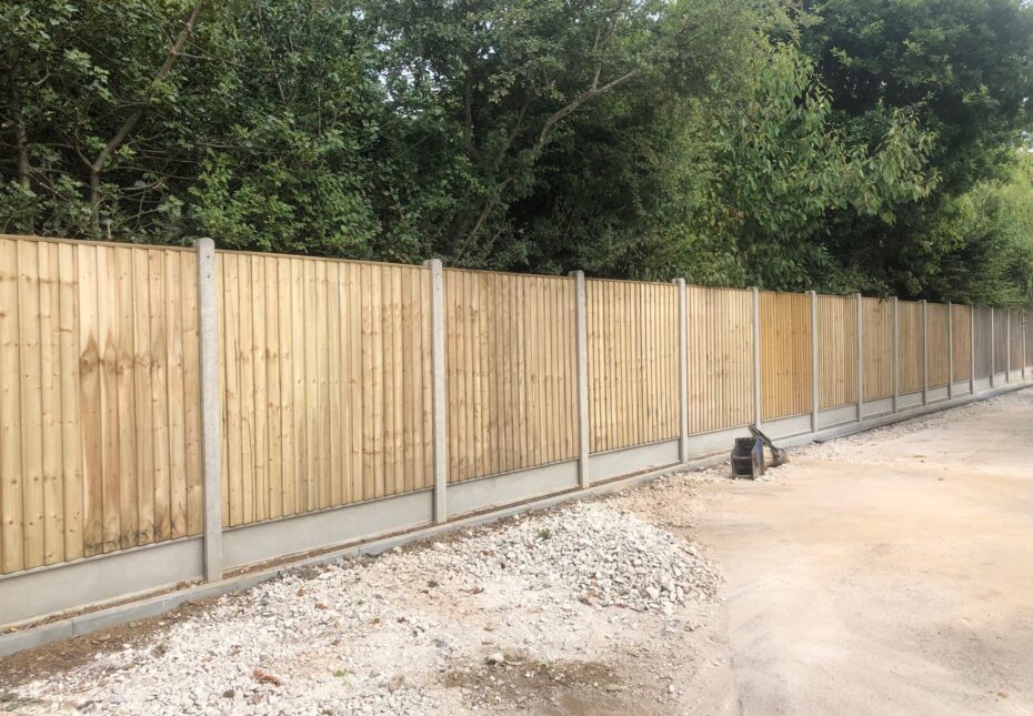 Tanalised closeboard panels with concrete posts and gravel boards